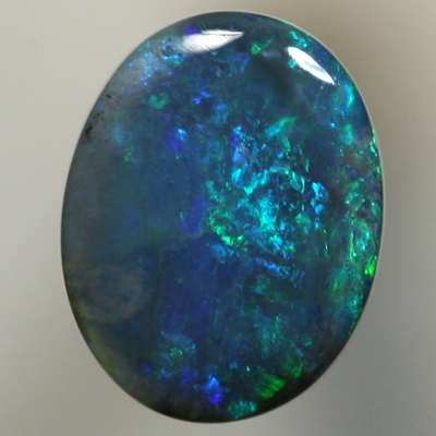 SOLID BLACK OPAL Strong forest greens sparkle over deep ocean blue
